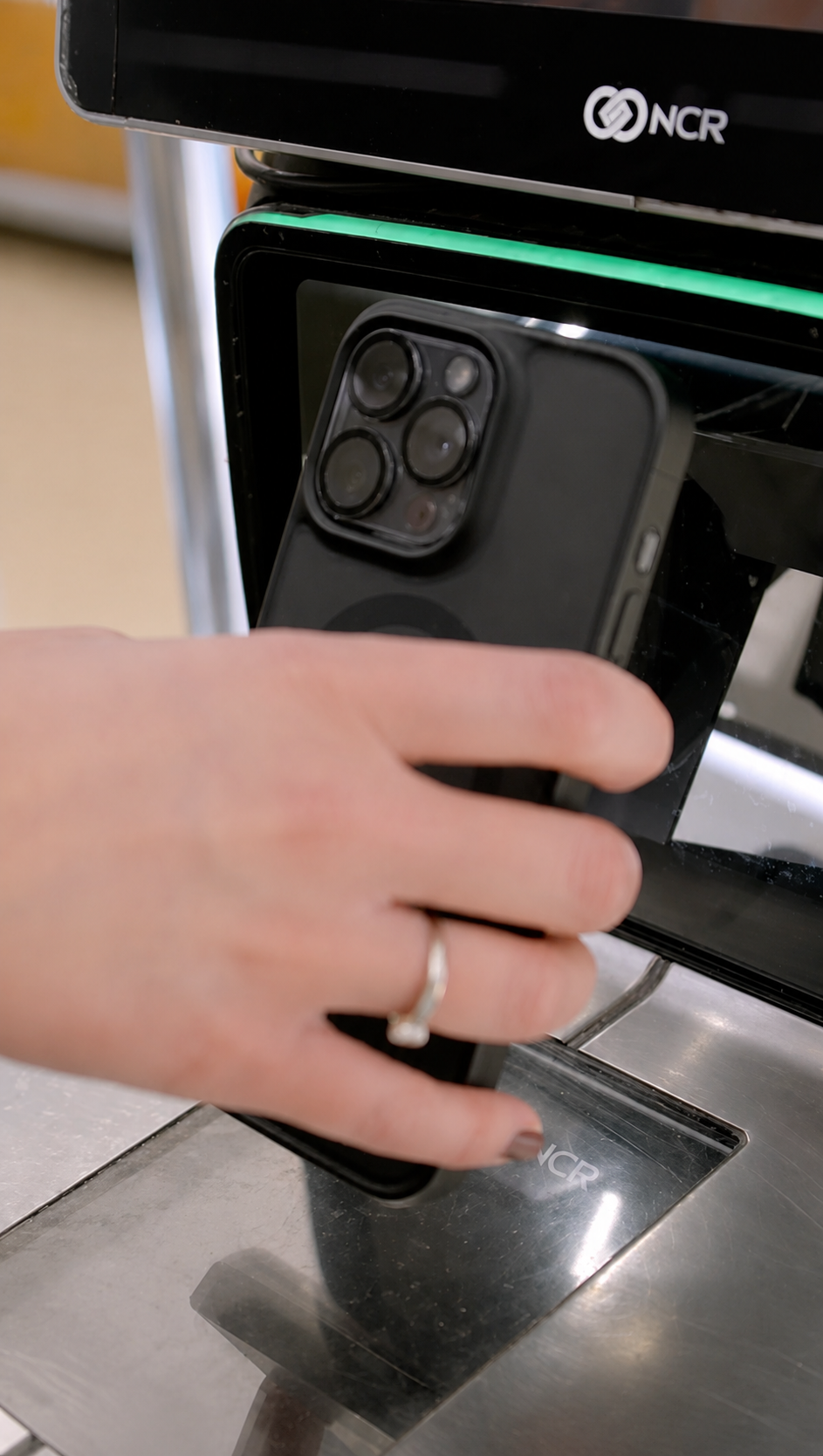 Phone scanning a voucher at a checkout